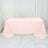 Pink tablecloth draped elegantly over a table in a studio setting.