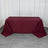 Burgundy tablecloth draped over a rectangular table