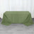 Green tablecloth draped over a table on a wooden floor.