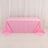 Pink tablecloth draped over a table against a plain background.