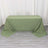 Green tablecloth draped over a rectangular table in a studio setting