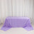 Purple tablecloth draped over a table in a bright setting.