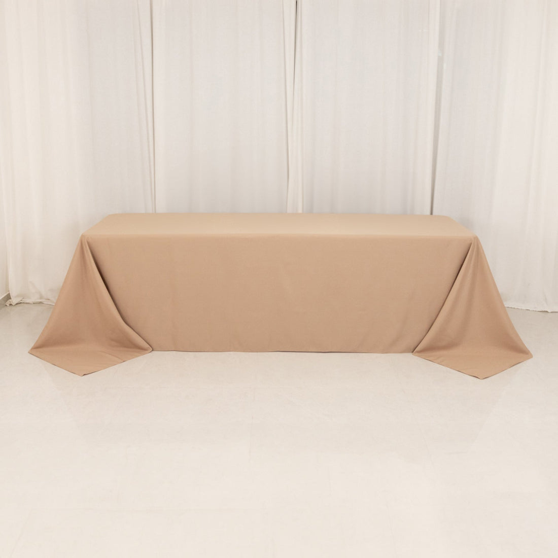 Beige tablecloth draped elegantly over a table.