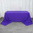Purple tablecloth draped over a table in a studio setting.