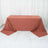 Rust-colored tablecloth draped over a rectangular table