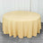 Round yellow tablecloth draping over a circular table
