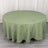 Round green tablecloth on a plain background.
