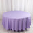 Round lavender tablecloth on a plain backdrop.