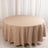 Round beige tablecloth on a circular table.