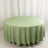 Round green tablecloth on a plain background.