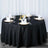 Elegant black table setting with gold accents and decorative elements.