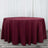 Burgundy round tablecloth on a plain background