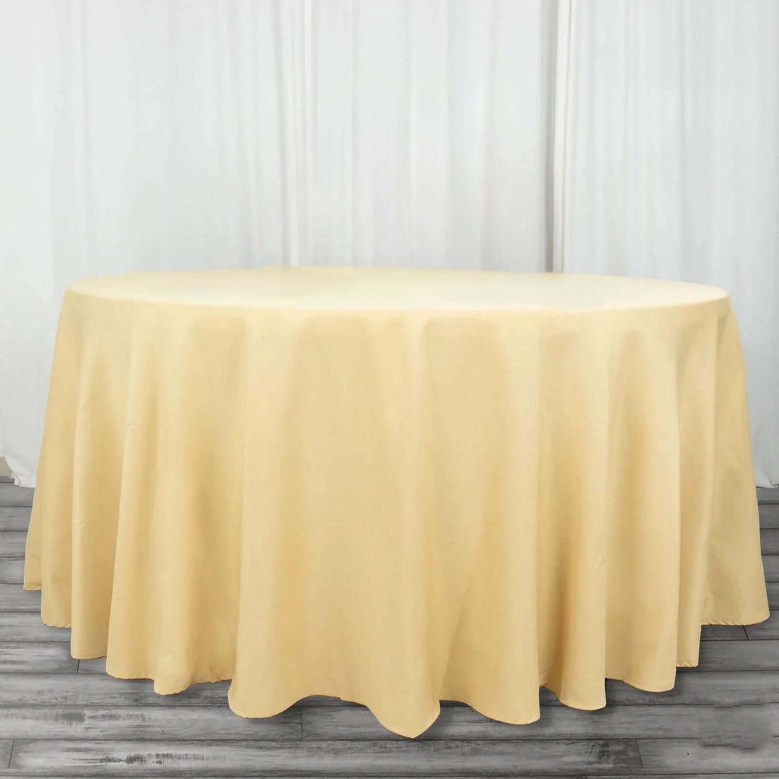 Round yellow tablecloth on a circular table.