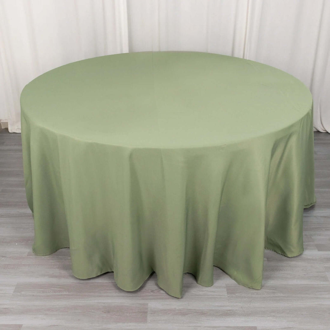 Round olive green tablecloth on a circular table