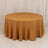 Round gold tablecloth draped elegantly over a circular table.