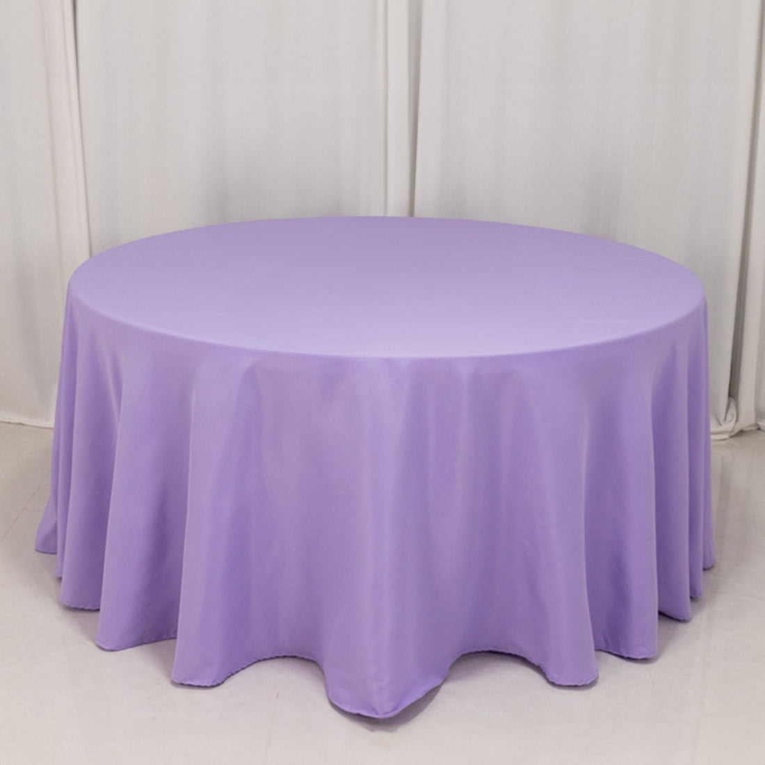Round purple tablecloth draped elegantly over a table.