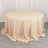 Round beige tablecloth draped elegantly on a circular table.