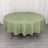 Round green tablecloth on a circular table with a smooth drape.