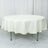 Round cream tablecloth on a round table