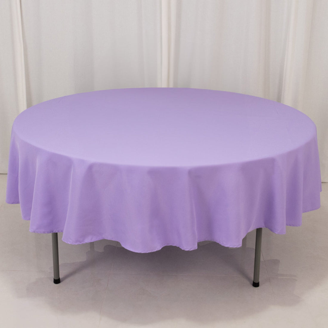 Round purple tablecloth draped elegantly over a table.
