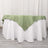 Green tablecloth with white underlay in a studio setting.