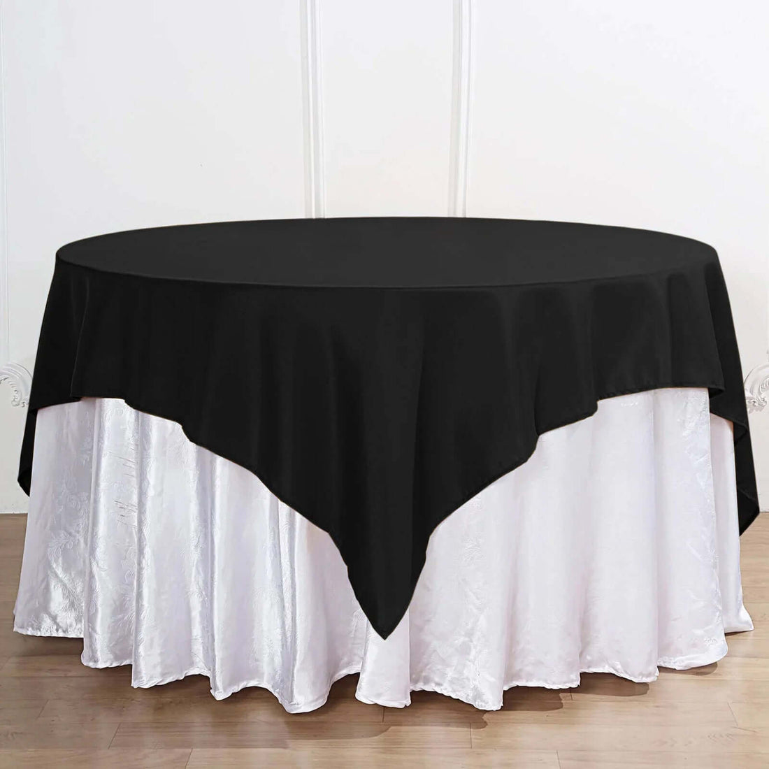 Black tablecloth draped over a white table for elegant dining setups.