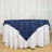 Navy tablecloth draped elegantly over a white table