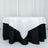 Black and white tablecloth with elegant draping on a round table