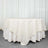 Round ivory tablecloth draped over a table