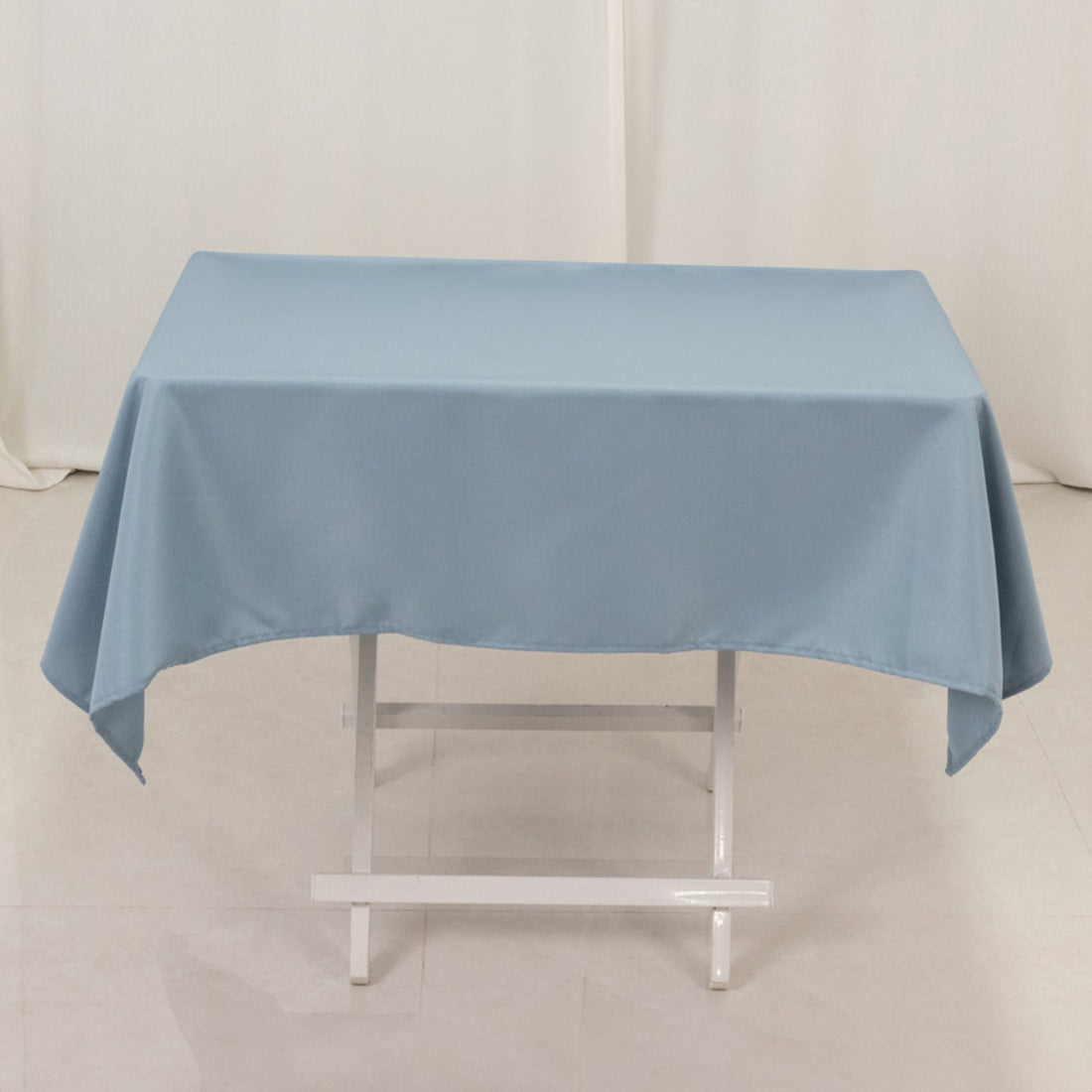 Blue tablecloth on a white table