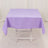 Purple tablecloth draped over a table with a plain background.