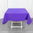 Purple tablecloth draped over a white folding table.
