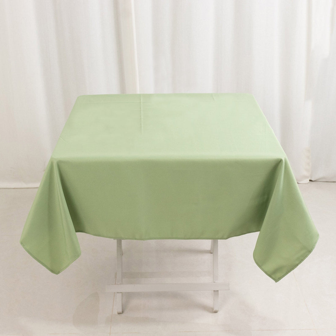 Green tablecloth on a folding table