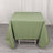 Green tablecloth draped over a white table in a studio setting.