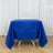 Blue tablecloth draped over a table in a bright setting.