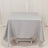 Gray tablecloth draped over a table in a studio setting.