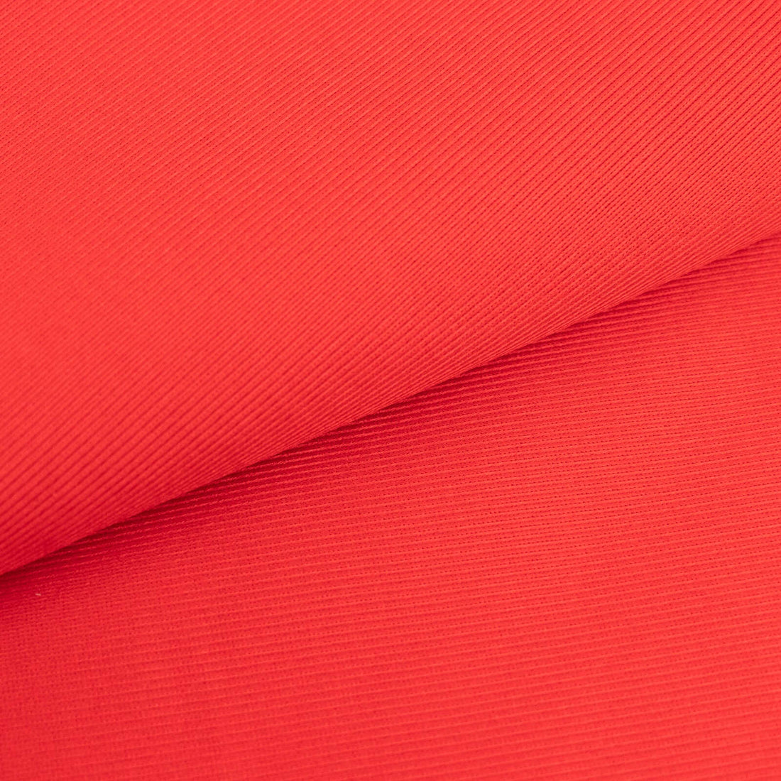 Textured red fabric showcasing ribbed design.