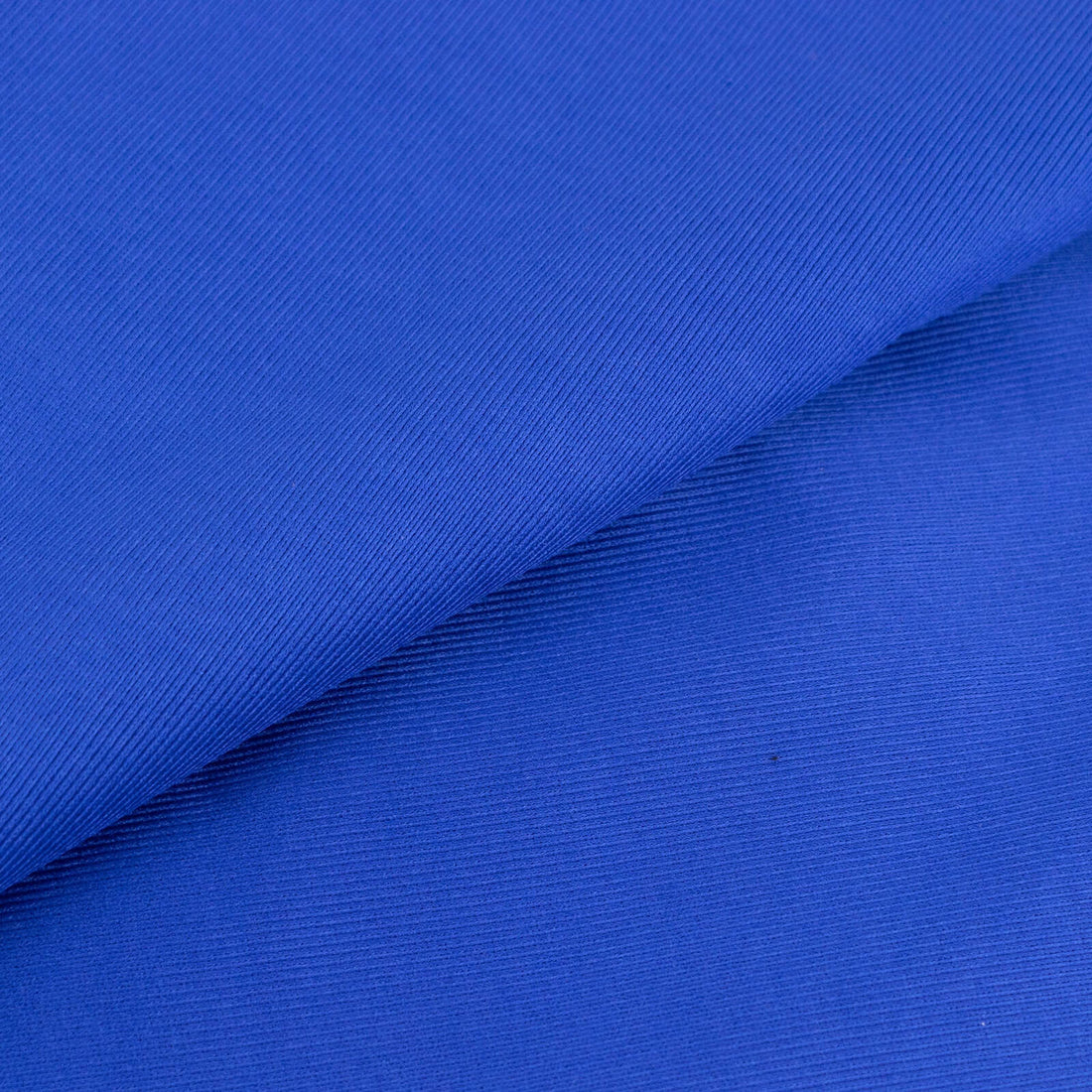 Blue textured fabric close-up showcasing its rich color and pattern.