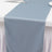 Gray satin table runner draped elegantly over a table.