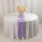 Elegant table setting with a floral centerpiece and lavender runner.