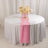 Elegant table setting with pink runner and floral centerpiece.