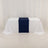 Navy blue table runner on a white tablecloth in a studio setting