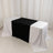 Table with black and white tablecloths arranged in a stylish setup.