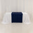 Table with navy and white draping on a plain background.