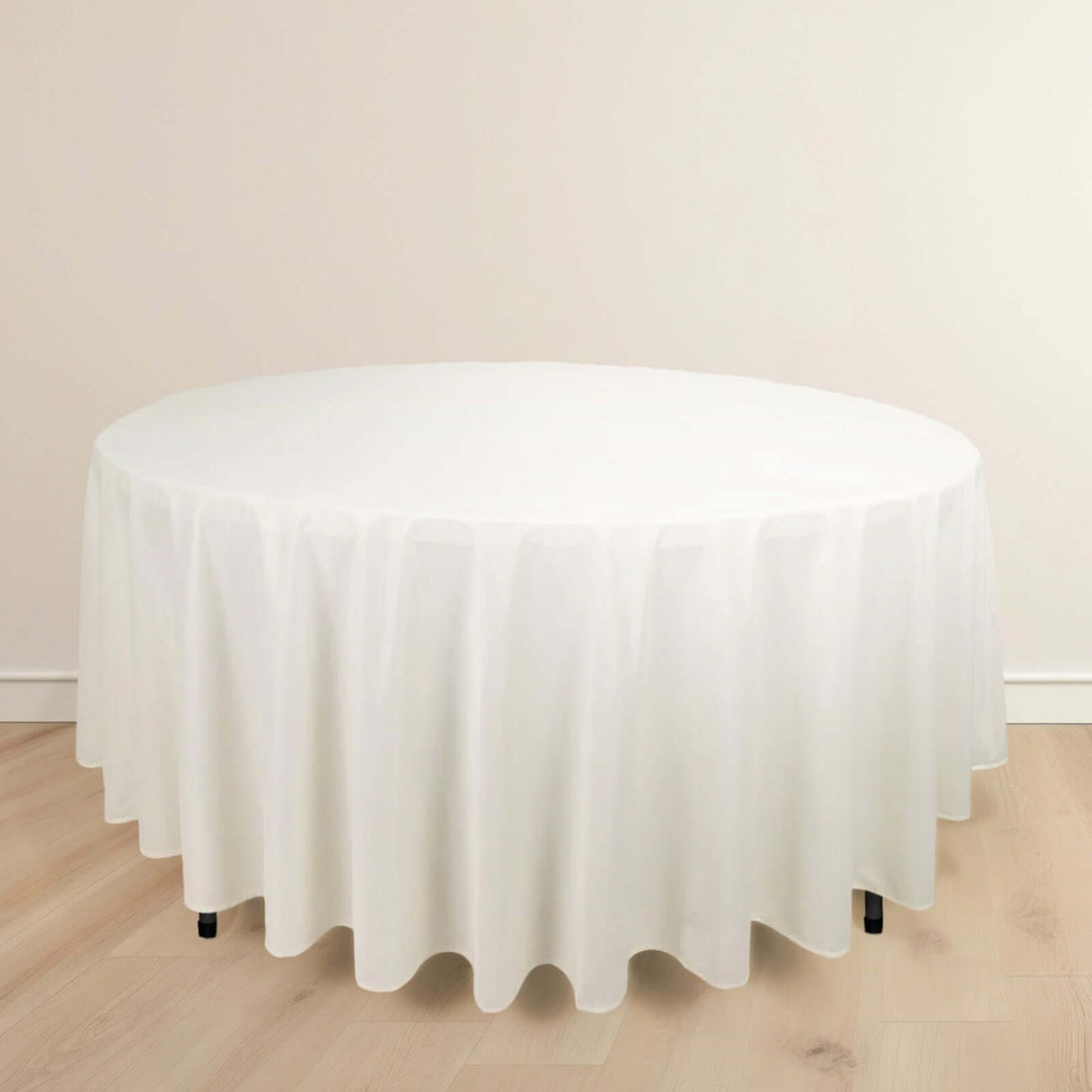 Round white tablecloth draped elegantly over a table.