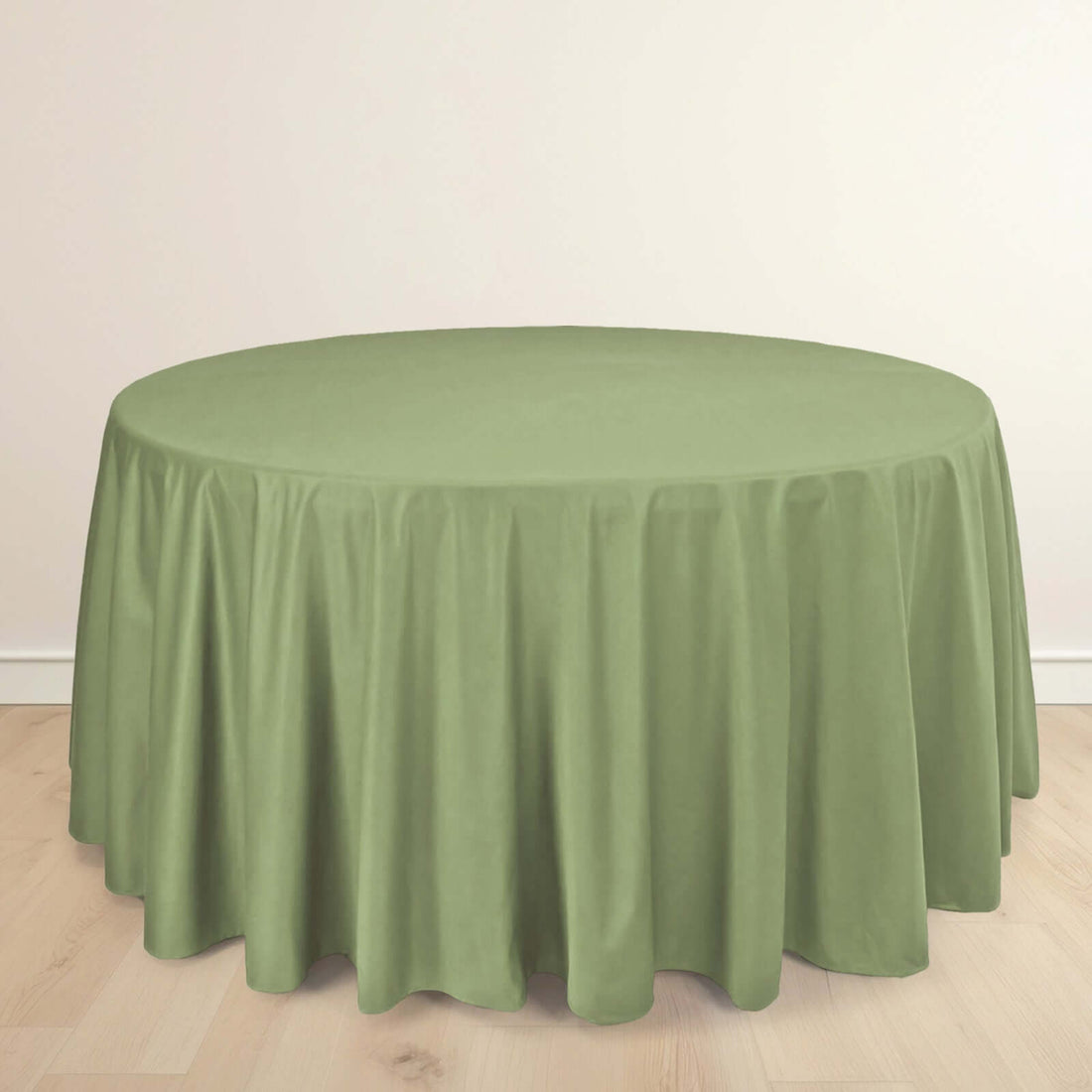Green round tablecloth in a studio-style shot.