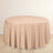 Round beige tablecloth with elegant draping on a plain background.
