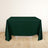 Dark green tablecloth draped over a table in a light room.