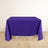 Purple tablecloth on a table against a light wooden floor backdrop.