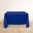 Blue tablecloth draped over a table on a light wooden floor.